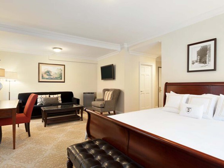 Executive Jr Suite with common area and a bed
