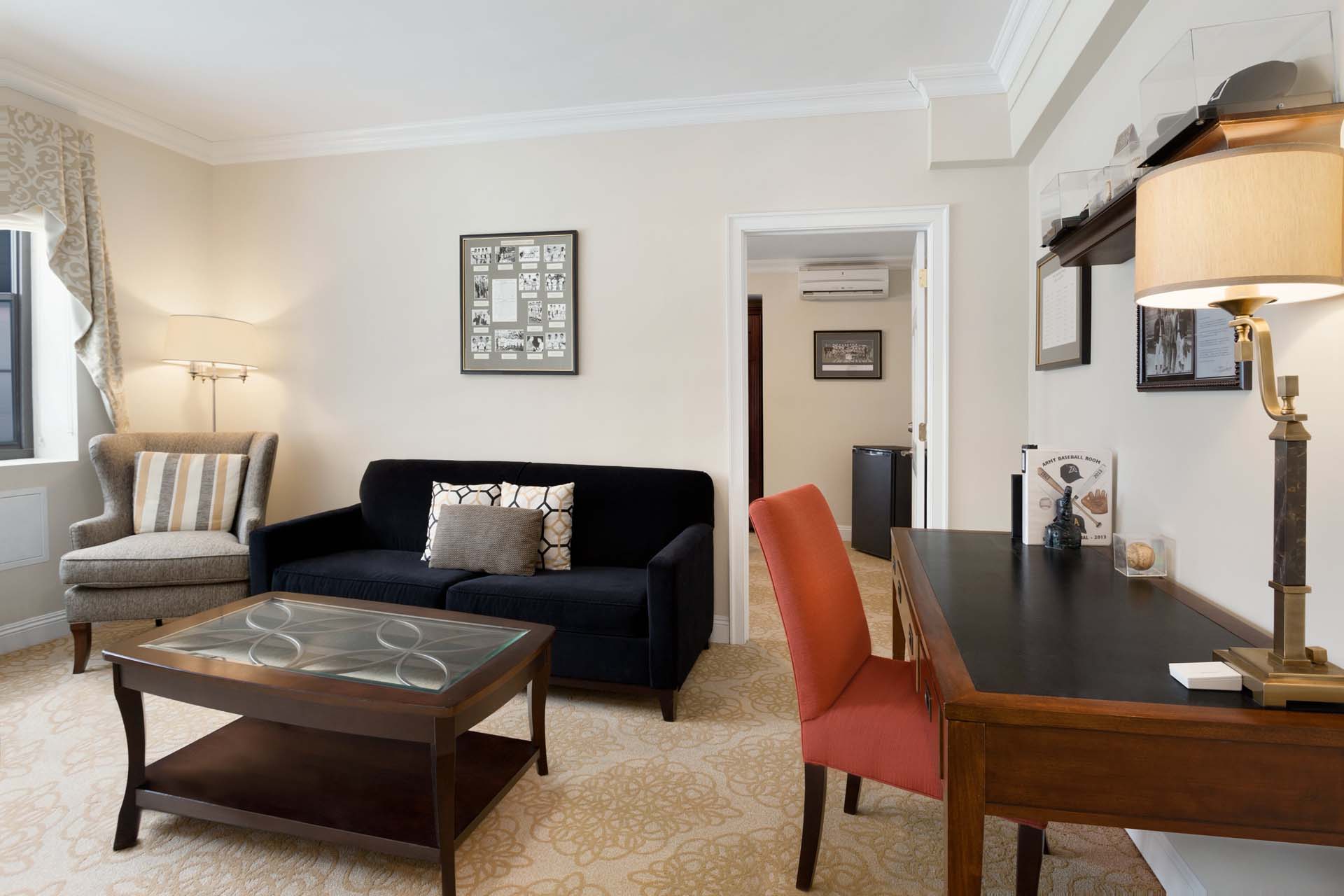 Executive Super Suite living space with desk and sofa
